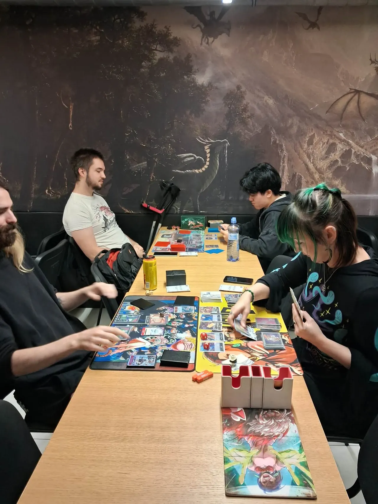Players at a long table at Černý Rytíř in the middle of their matches